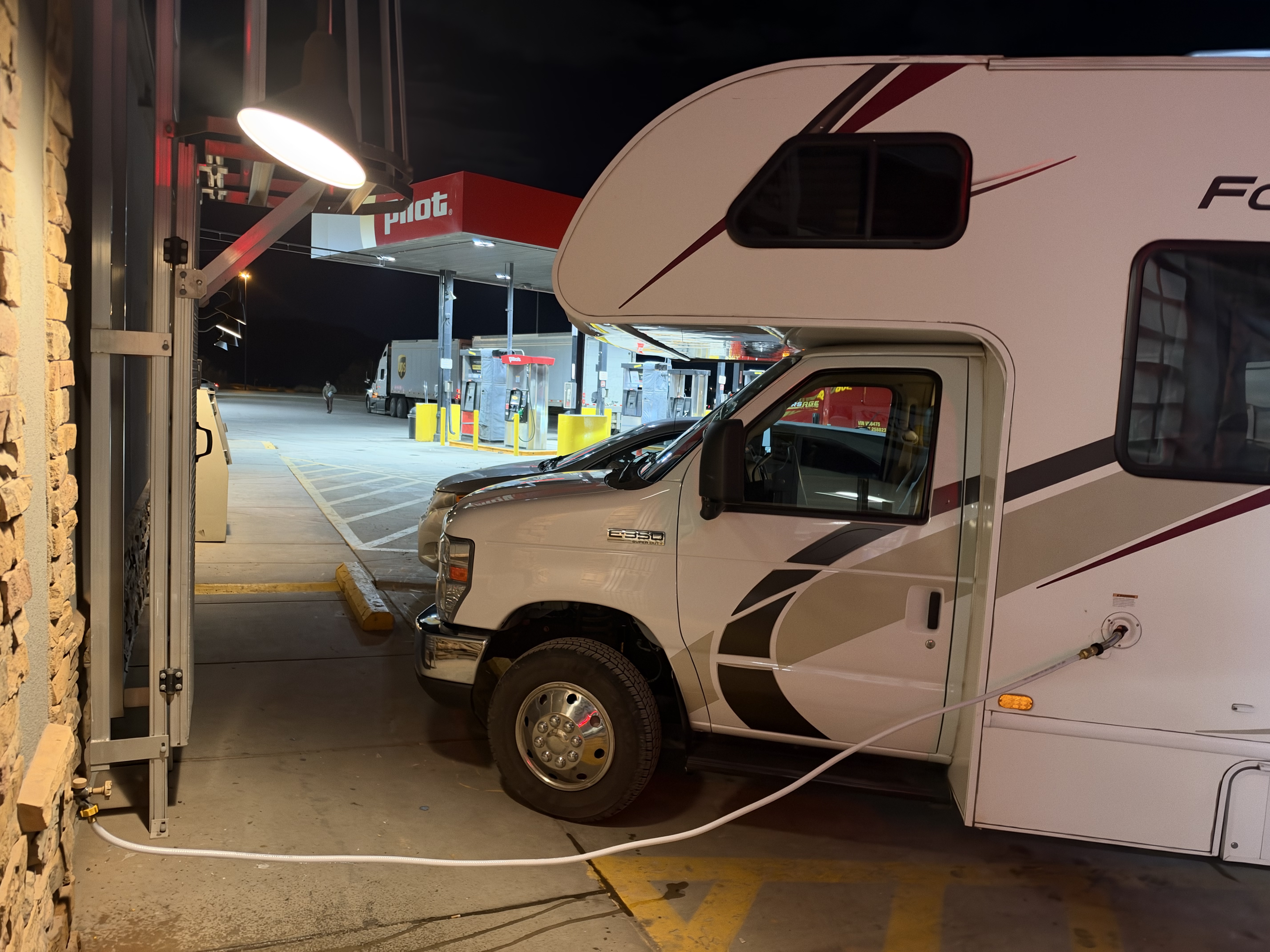 The 23U parked at a Pilot station with a water hose connected