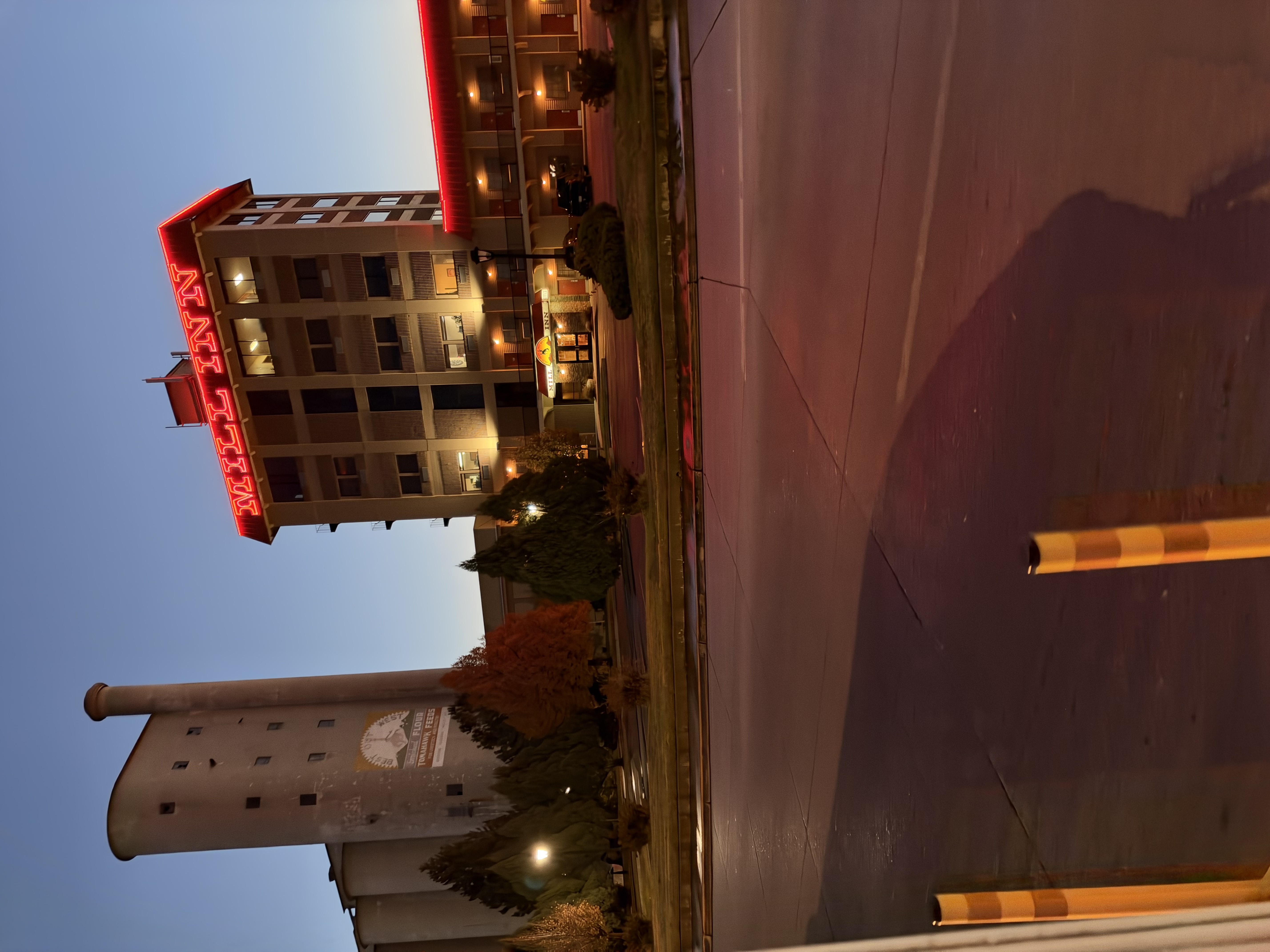 The Mill Inn sign and grain elevator in Sheridan